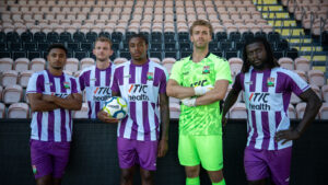 Bloemen uit het clublogo tekenen Barnet uitshirt 2026-2027